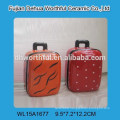 Lovely ceramic saving money bank in suitcase shape